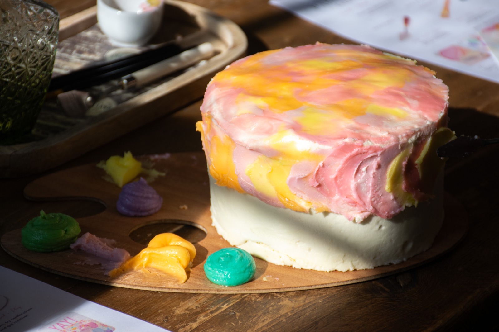 A colourful hand-painted cake shown in close-up