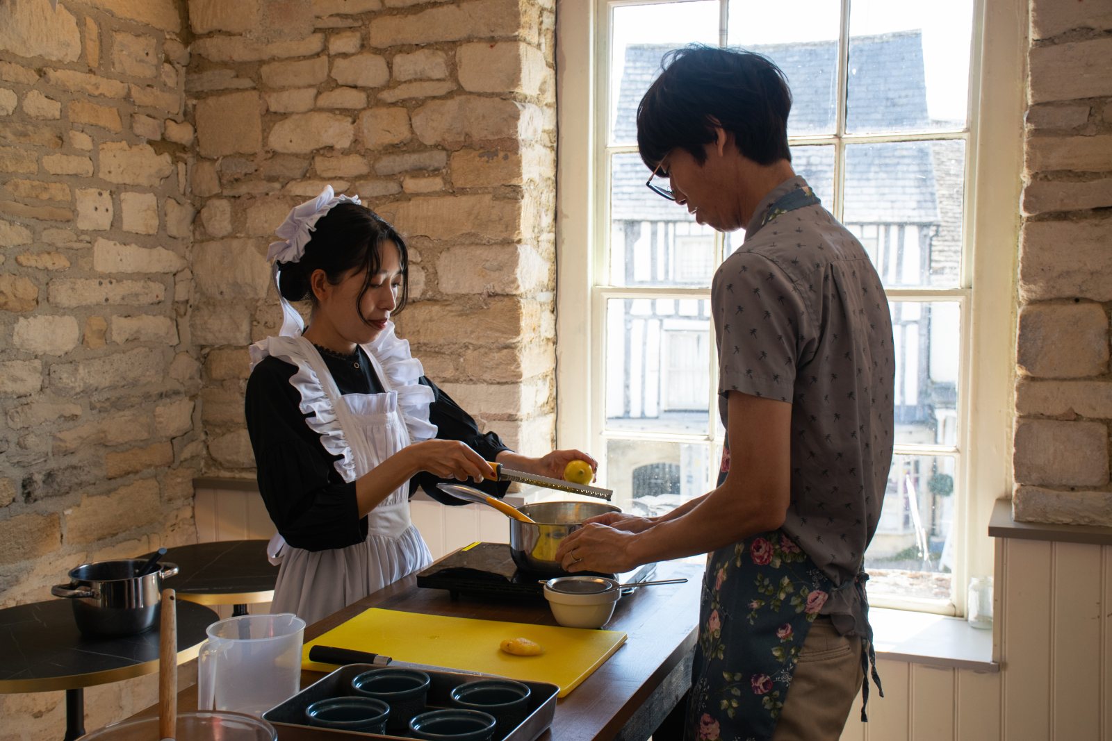 Guests icing festive biscuits around the workshop tables